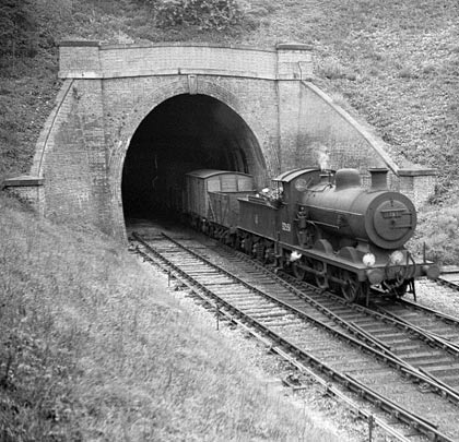 Engine 32551 leaves the tunnel on Tunbridge West freight duties on 17th May 1950. Note the siding that ends by the right hand wing wall.