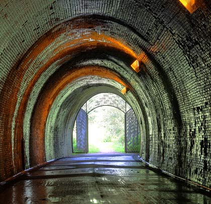 Patches of spalled brickwork are a feature of the tunnel - unsurprising as large sections of the lining are wet even in summer.