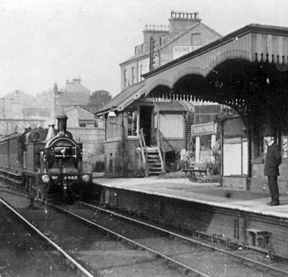 Locomotive 822 passes the signal box at Thorneywood Station with an afternoon stopping service from Basford, circa 1911.